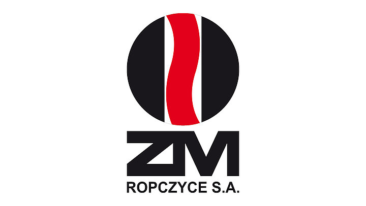 Black circle with thin red letter "s" inside. Below the circle black text "ZM ROPCZYCE S.A.".